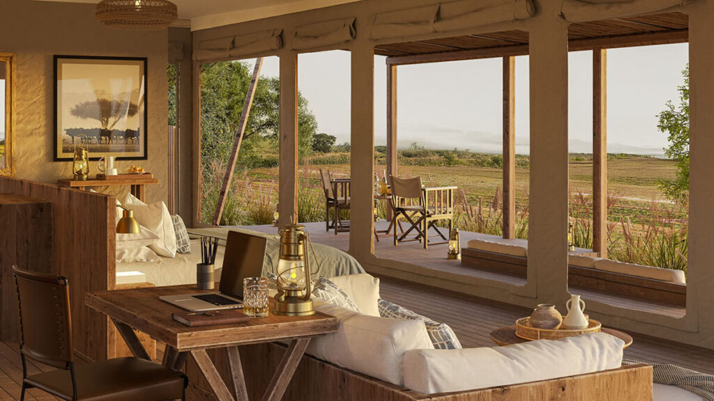 Open living area of a Little Enkewa tent with natural wooden furnishings and views across the plains.