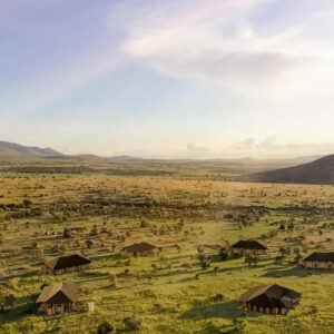 Aerial view of Little Enkewa camp with independent safari tents set in the Masai Mara landscape