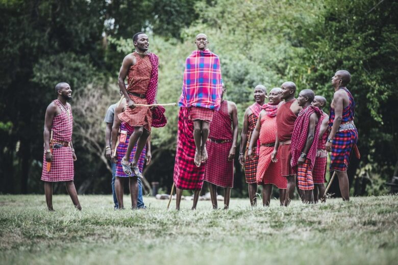 Maasai warriors performing the traditional jumping dance near Enkewa Camp in the Masai Mara