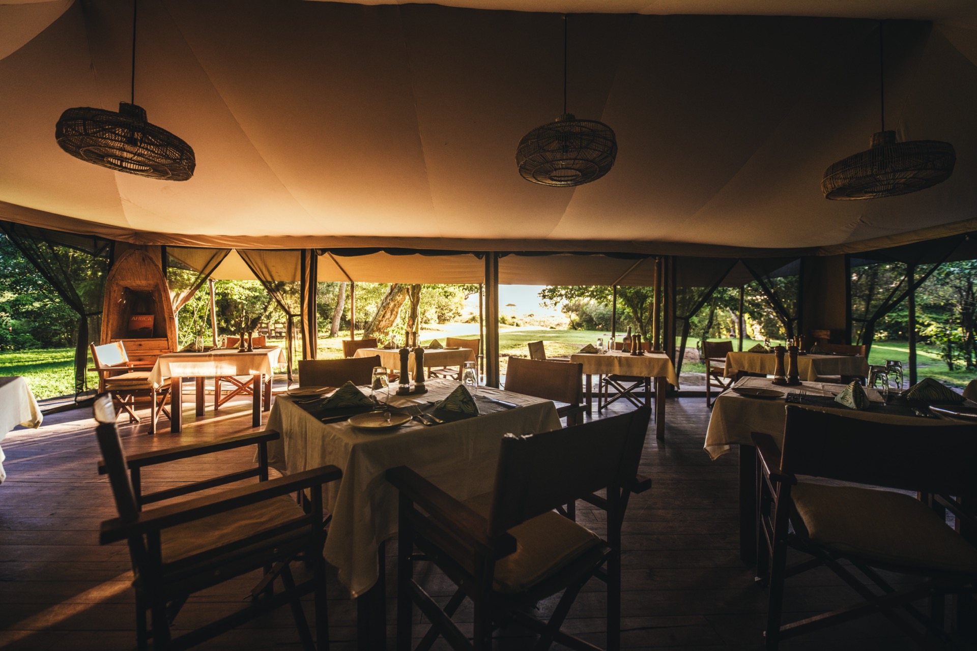Exclusive traditional luxury safari tent lit up under the African night