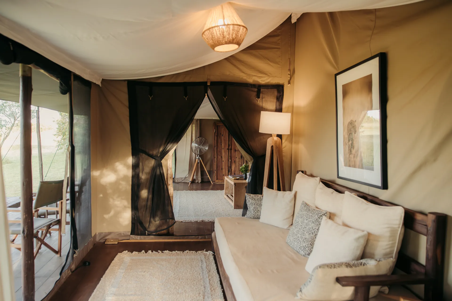 Double tent at Enkewa Camp – lounge with sofa and reading lamp