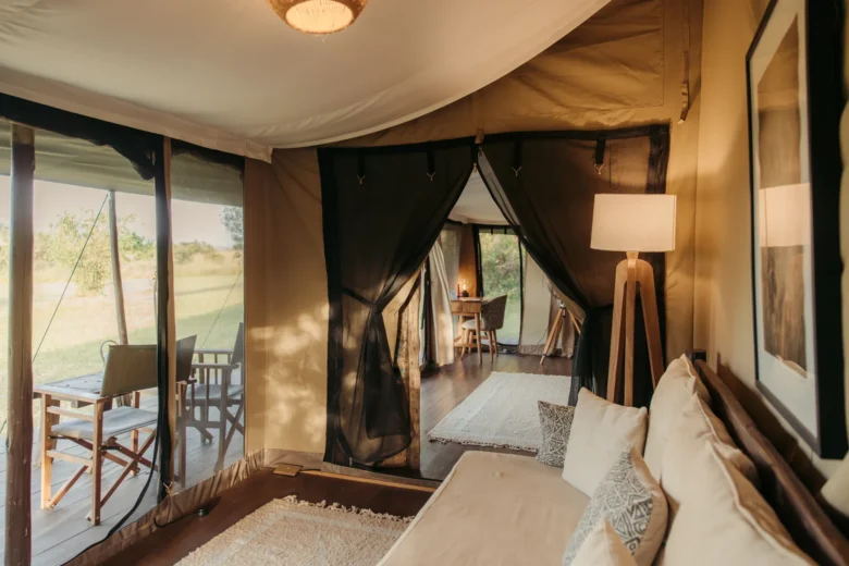 Double tent at Enkewa Camp – lounge with doors open to the veranda and the bush