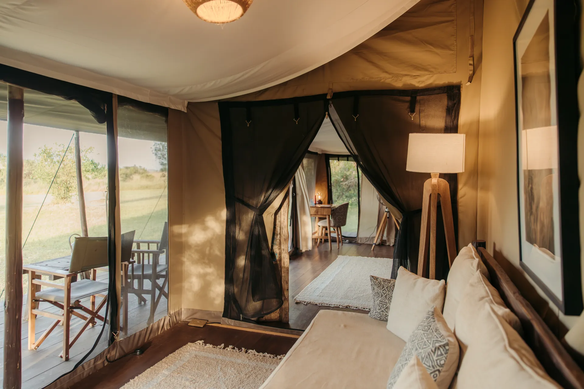 Double tent at Enkewa Camp – lounge with doors open to the veranda and the bush