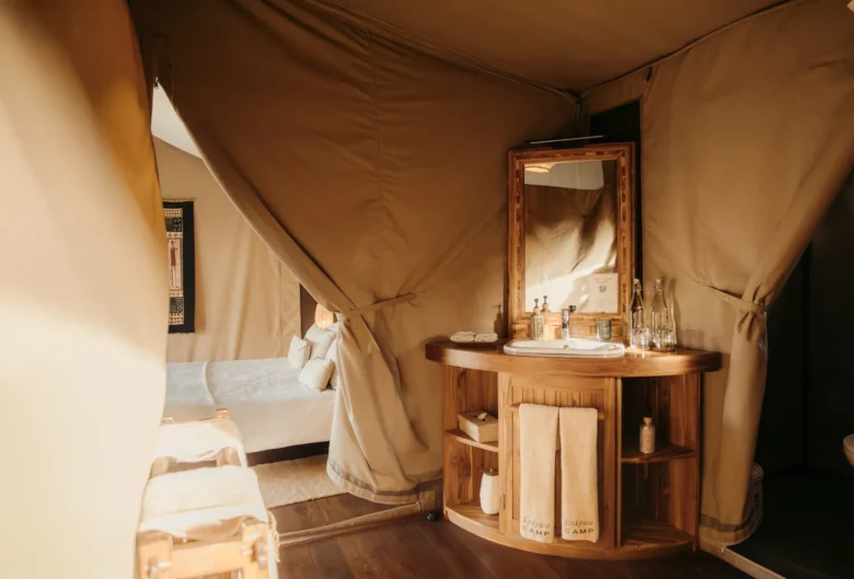 Double tent at Enkewa Camp – wooden dressing table beside the bedroom