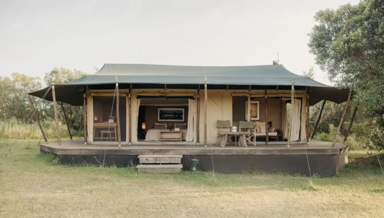 Double tent at Enkewa Camp on a raised wooden deck in the Masai Mara