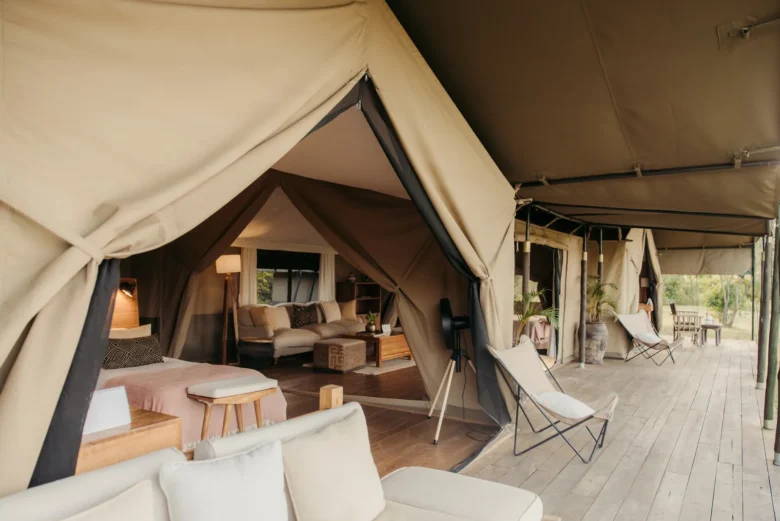 Family tent at Enkewa Camp with its central lounge opening onto the bedrooms