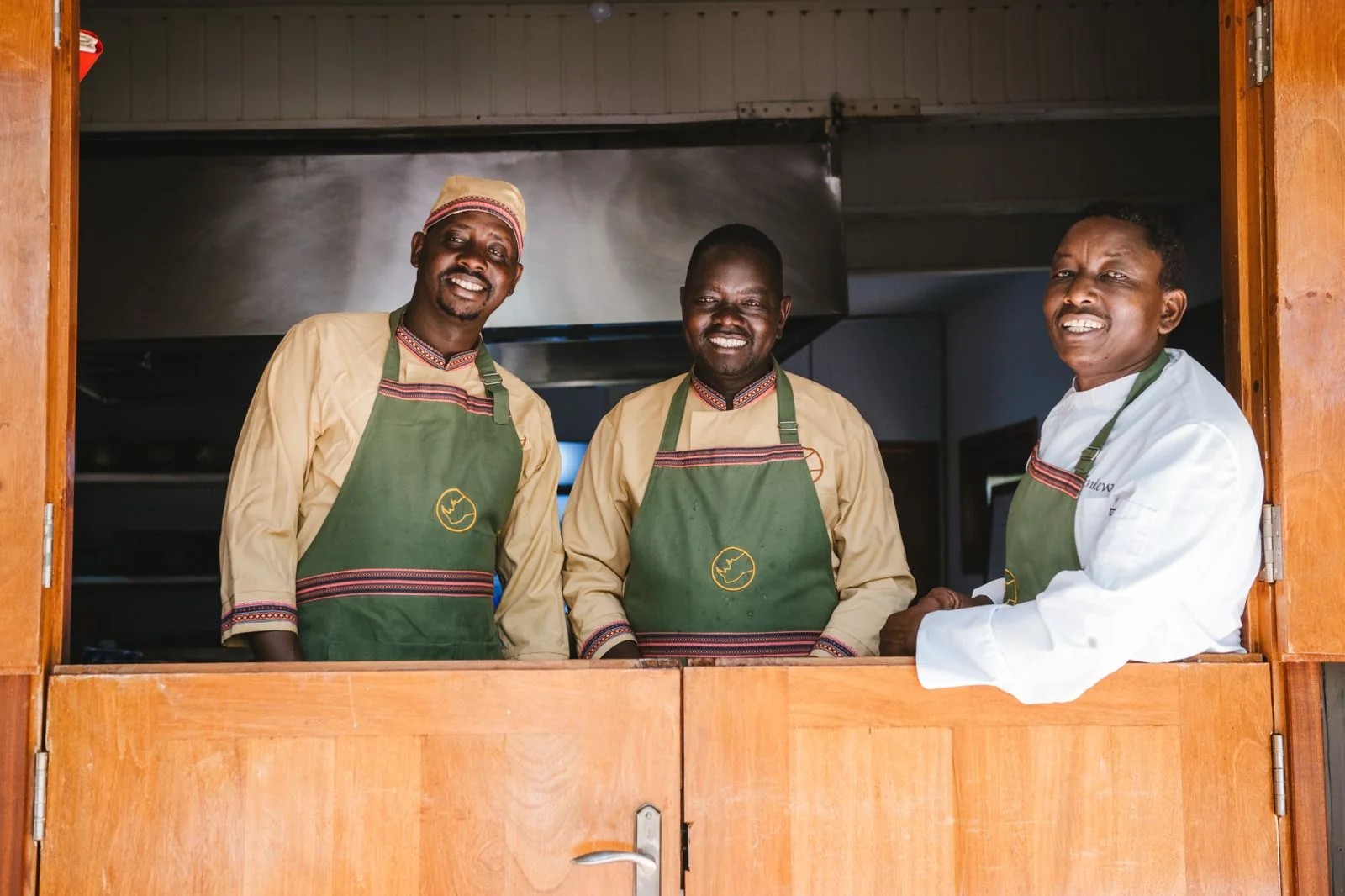 Enkewa Camp kitchen team at the kitchen window