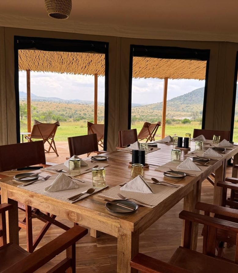 Open-sided dining area at Little Enkewa looking out over the Masai Mara savannah