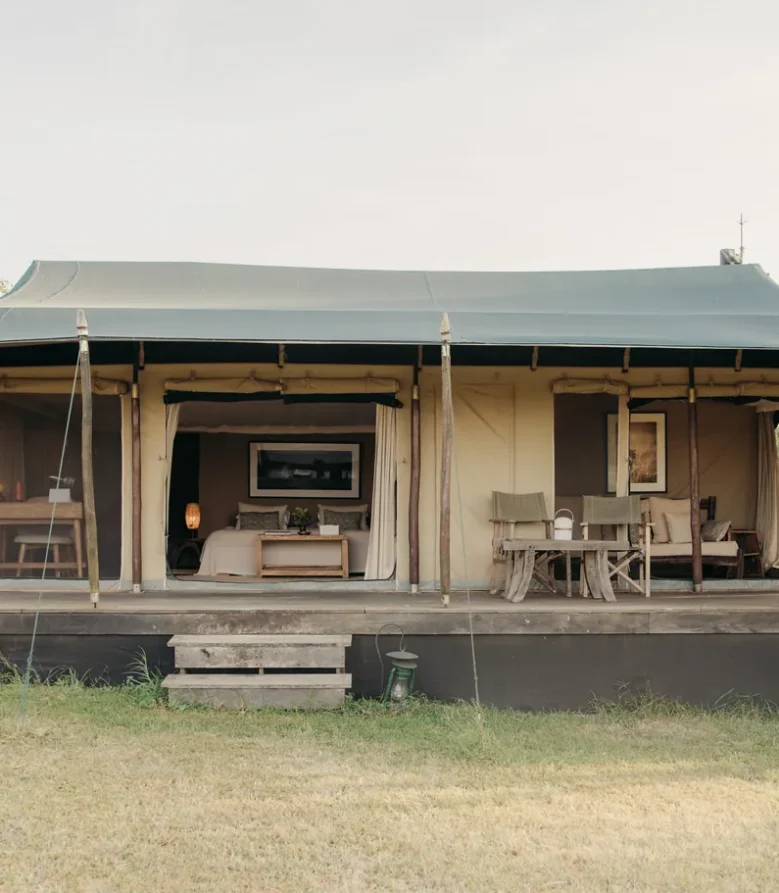 Double tent at Enkewa Camp on a raised wooden deck in the Masai Mara